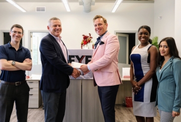 Eyet Law Team Receiving Funds from New Brunswick City Center Representative