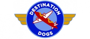 Destination Dogs in white text wraps in a blue circle around an image of a propeller plane with a hot dog as its fuselage